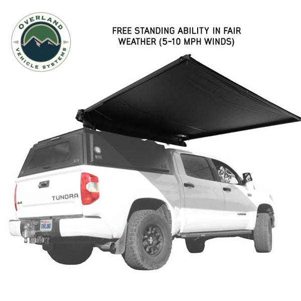 OVS XD Nomadic 90 Self-Deploying Awning — Feature shot: freestanding in wind with poles stowed