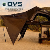 OVS XD Sherpa Tent Awning — Lifestyle shot: awning zipped to a Sherpa tent at a desert camp. Quick shade for travelers camping in hot, open country