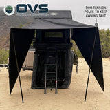OVS XD Sherpa Tent Awning — Lifestyle shot: two telescoping tension poles holding the awning out over the Sherpa ladder