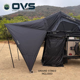 OVS XD Sherpa Tent Awning — Lifestyle shot: ground stakes and guy lines securing the awning at a desert camp
