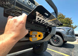 Backwoods Adventure Mods Flip-Up License Plate Holder (Hawse Fairlead) — Feature shot: plate flipped up exposing the hawse fairlead and winch