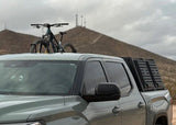 Backwoods Adventure Mods Bike Tray Mounts (Universal) — Lifestyle shot: 3rd gen Tundra with a mountain bike on the bed rack in the desert