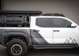 Backwoods Adventure Mods DRIFTR Roof Rack (2024–2027 Tacoma) — Lifestyle shot: Tacoma with the roof rack and a Backwoods Adventure Mods bed rack