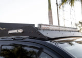 Backwoods Adventure Mods DRIFTR Roof Rack (2025–2027 4Runner) — Feature shot: front wind fairing carrying an LED light bar