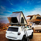OVS LD TMON clamshell rooftop tent open on a white 4Runner at sunset