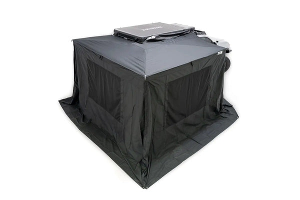 FSR 270 Awning Walls V2 — Lifestyle shot: walls zipped onto the 270 awning on a Toyota Tacoma, turning the side and rear into an enclosed camp room