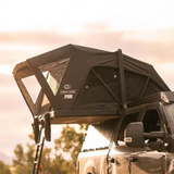 FSR Nova — Lifestyle shot: Nova deployed on the back of a pickup at a scenic campsite at dawn, the smallest-footprint FSR tent for one or two