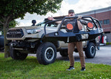 Backwoods Adventure Mods Hi-Lite Bull Bar (2016–2023 Tacoma) — Feature shot: aluminum shell held in one hand
