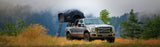 Roofnest Meadowlark — Lifestyle shot: open soft shell tent on a pickup in a misty meadow, a light, simple setup for quick getaways