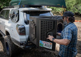 Backwoods Adventure Mods Overland Storage Box (Universal) — Lifestyle shot: white 4Runner with a canoe on the roof and the box on the rear bumper