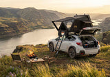 Roofnest Condor 2 Air — Lifestyle shot: tent deployed on a Subaru at a campsite for a quick overnight trip