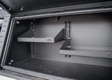 Backwoods Adventure Mods Bed Rack Storage Box (2005–2027 Tacoma) — Feature shot: interior shelves organizing gear
