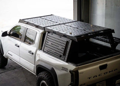 Backwoods Adventure Mods DRIFTR Bed Rack Topper (2005–2027 Tacoma) — Feature shot: topper on a 3rd gen Tacoma bed rack with storage add-ons