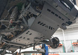 Backwoods Adventure Mods Aluminum Skid Plate System (2005–2023 Tacoma) — Feature shot: skid plates installed under a Tacoma