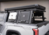 Backwoods Adventure Mods Bed Rack Storage Box (2007–2027 Tundra) — Feature shot: box closed with accessories on the MOLLE panel