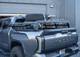 Backwoods Adventure Mods Overland Bed Rack Mid Height (2007–2027 Tundra) — Feature shot: lights, spare tire, traction boards and bike trays mounted
