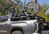 Backwoods Adventure Mods Bike Tray Mounts (Universal) — Feature shot: bike tray attached to a bed rack with the mounts